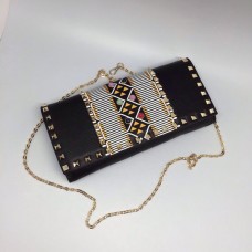 Женская кожаная сумка Valentino Garavani Rockstud черная на цепочке